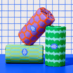 Three rolls of Who Gives a Crap paper towel against blue and while bathroom wall
