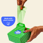 Who Gives a Crap compostable rubbish bag being pulled out of the box with sticker over image that says made with plant matter