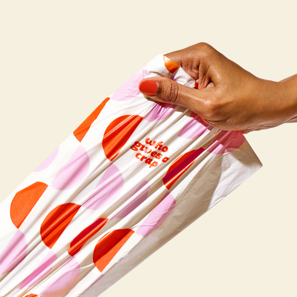 Who Gives a Crap small 100% recycled plastic garbage bag being pulled by a hand to show how strong they are