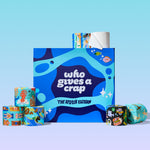 The Who Gives A Crap Splash Edition box surrounded by a collection of illustrated bamboo toilet paper rolls, each featuring unique water-themed artwork, on a light blue background