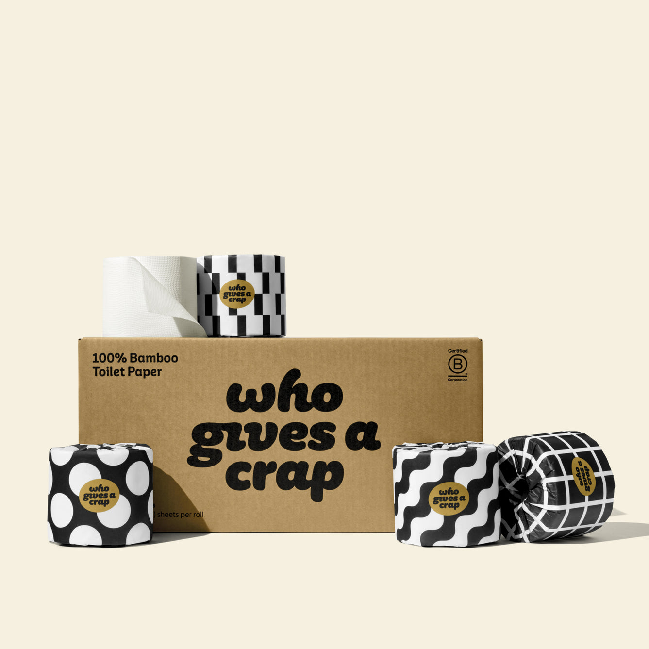 A small box of Who Gives A Crap 100% Bamboo Toilet Paper with black and white wrappers - eco-friendly, biodegradable and sustainable toilet paper 