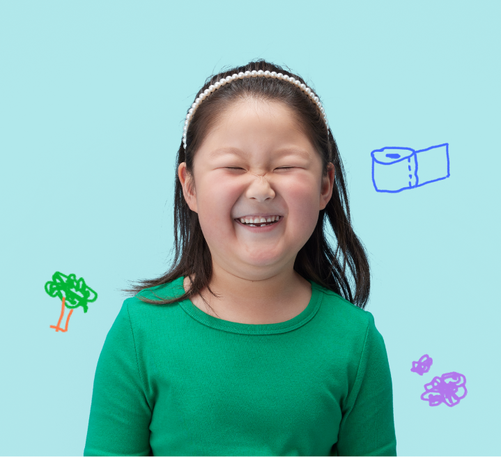 Little girl smiling with small drawings floating around her