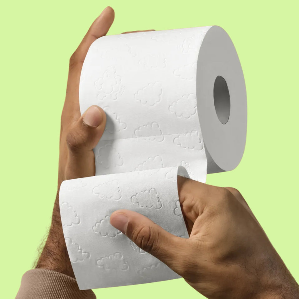 Super soft 3-ply bamboo toilet paper being held.